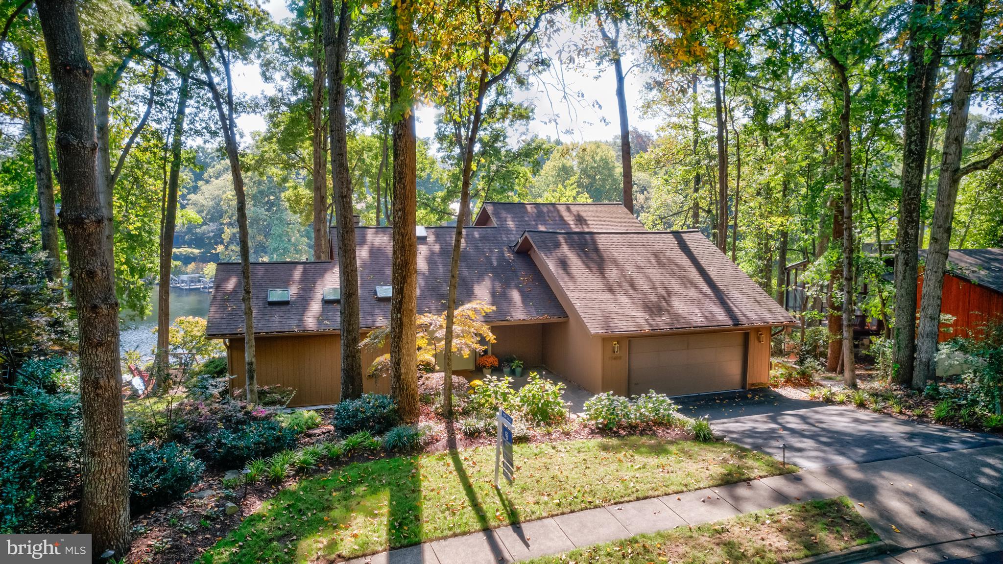 a view of a house with a yard and sitting area