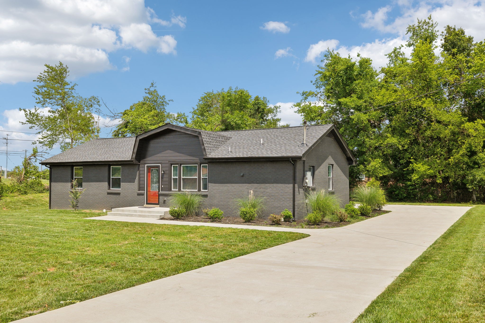 a front view of a house with garden