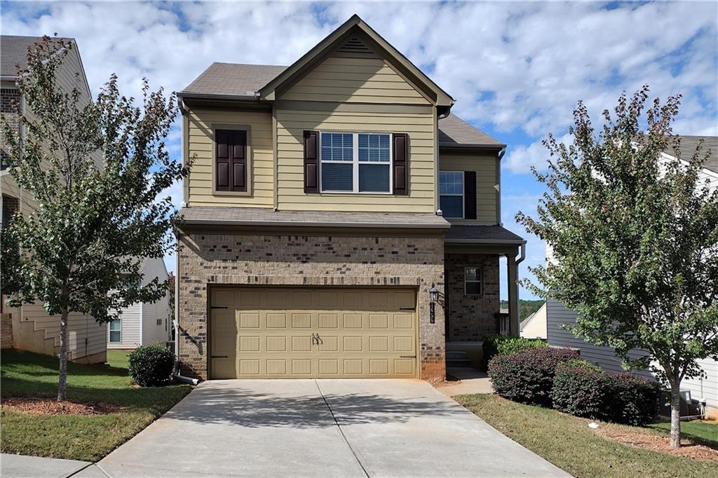 a front view of a house with a garage