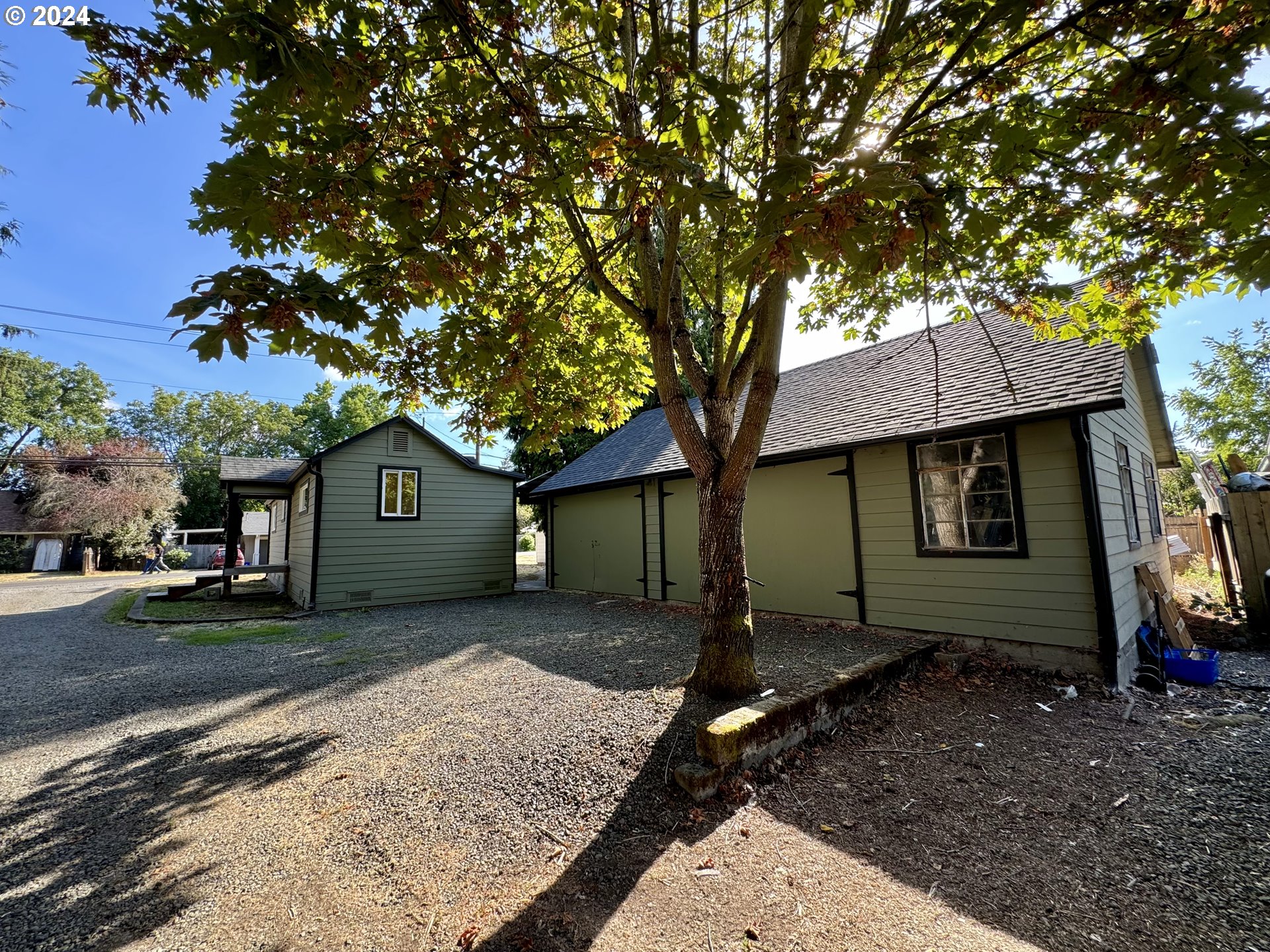 a house view with a backyard space