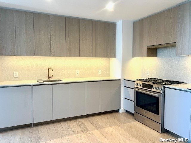 a kitchen with a sink and a stove