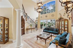 a living room with furniture and a painting on the wall