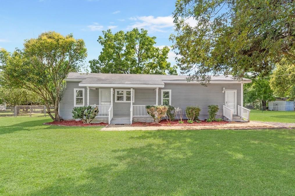 front view of a house with a yard