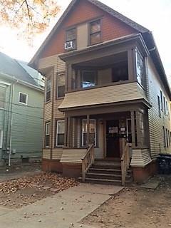 a view of a house with a door and wooden floor