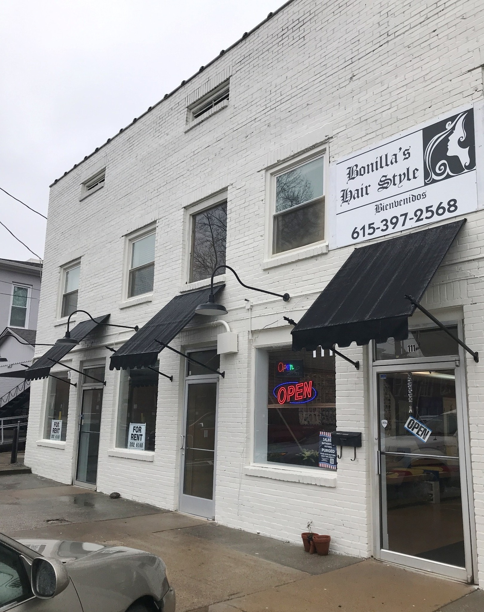 a front view of a building with retail shop