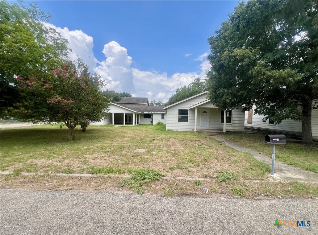 a front view of a house with a yard