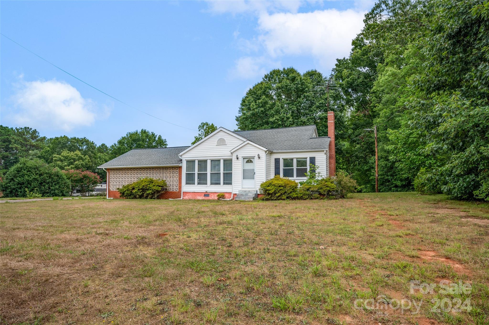 a front view of a house with yard