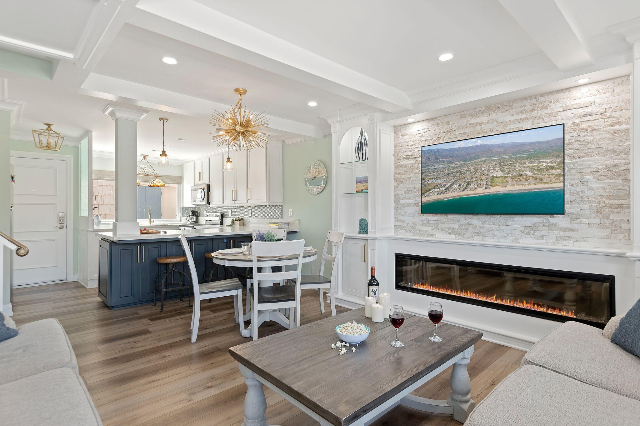 a living room with furniture a fireplace and a flat screen tv