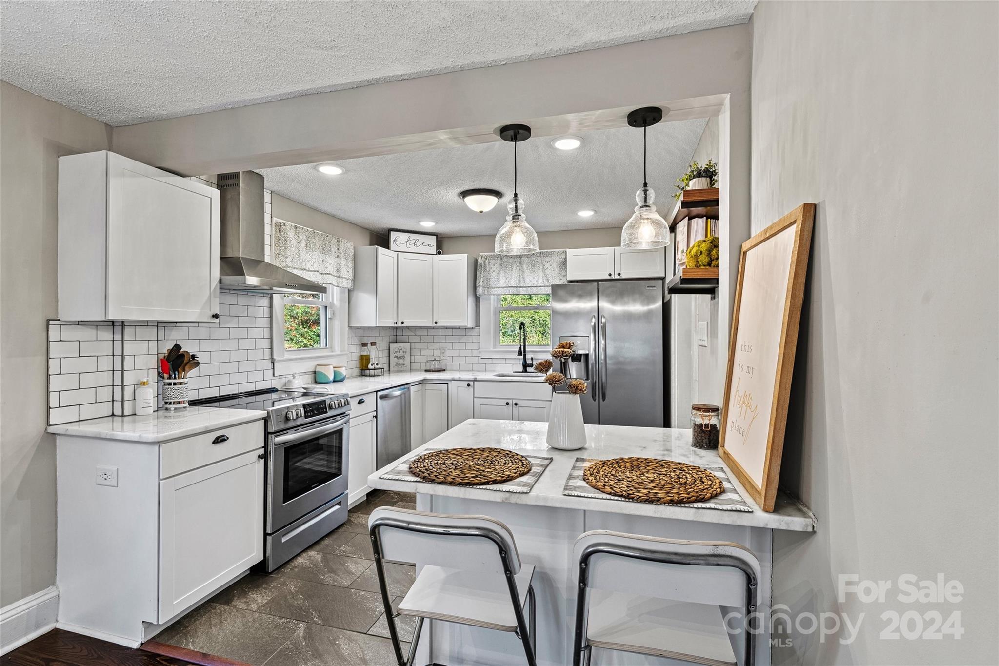 a kitchen with a stove a refrigerator and a stove