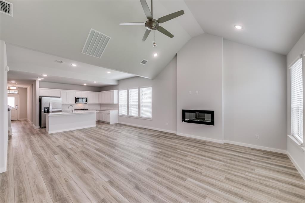 a view of a kitchen with a sink and a microwave