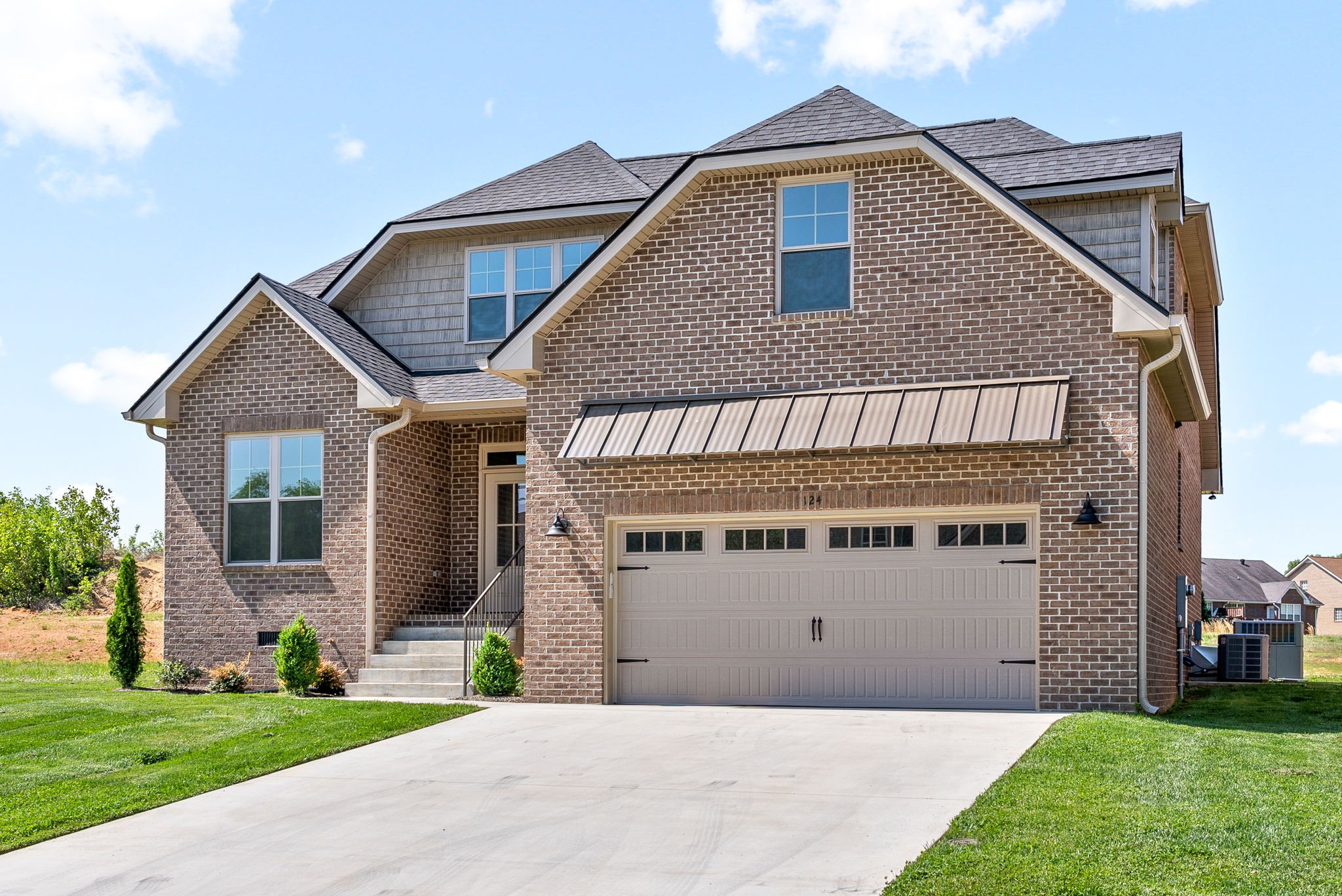 a front view of a house with a yard