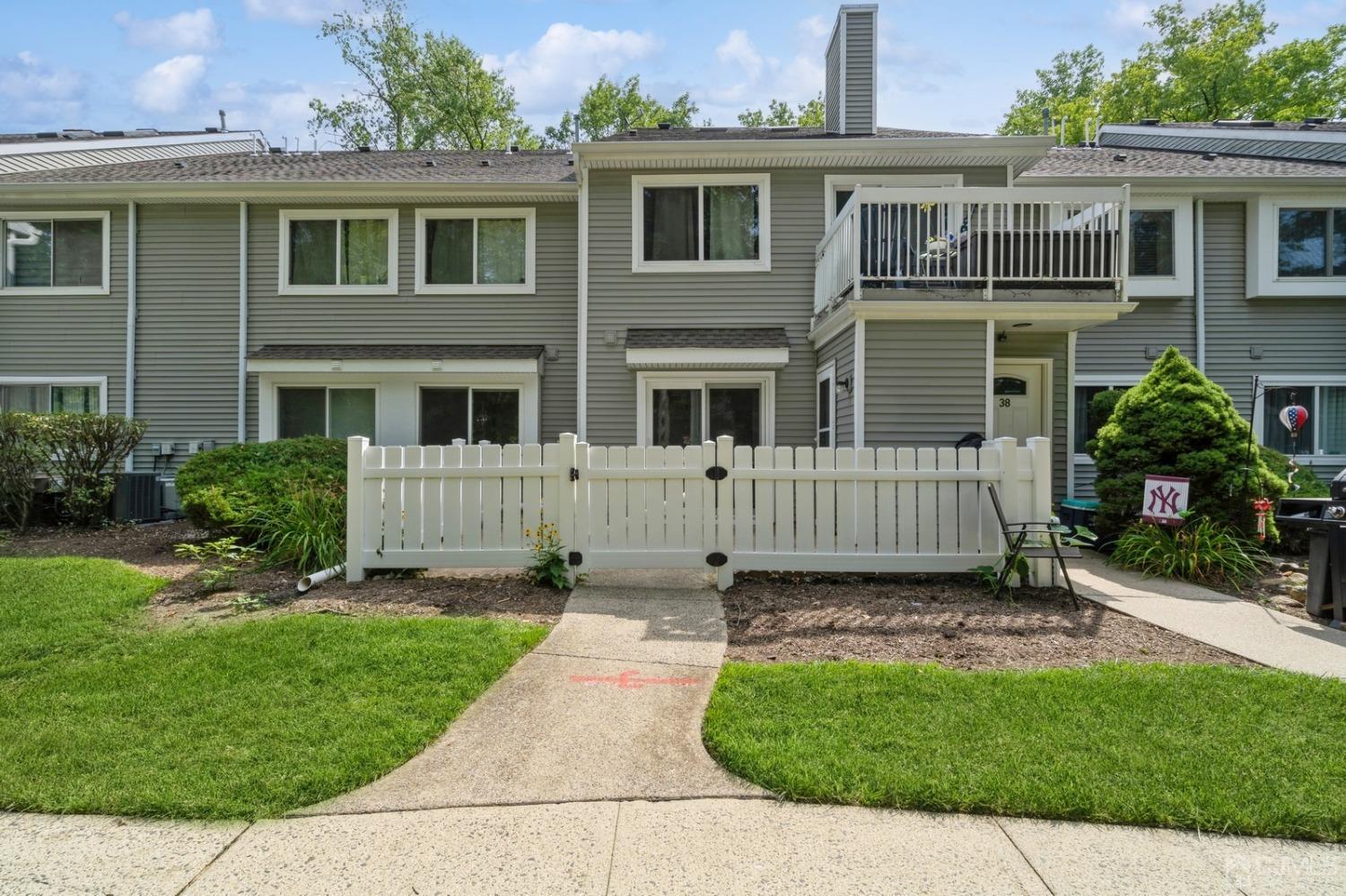 a view of a house with a yard and plants