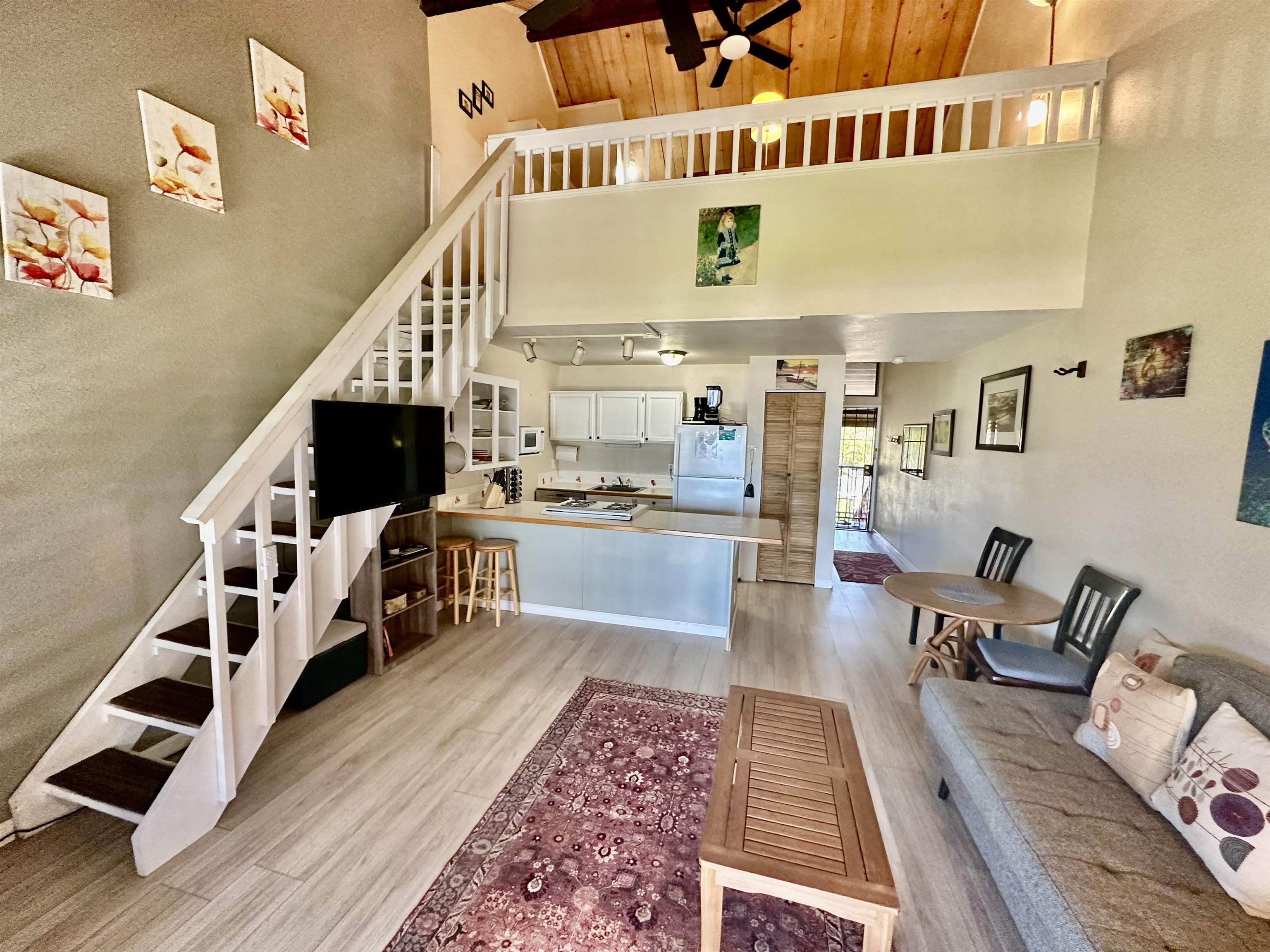 a view of kitchen with furniture and staircase