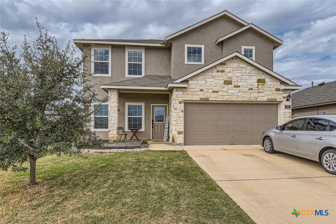 front view of a house with a yard