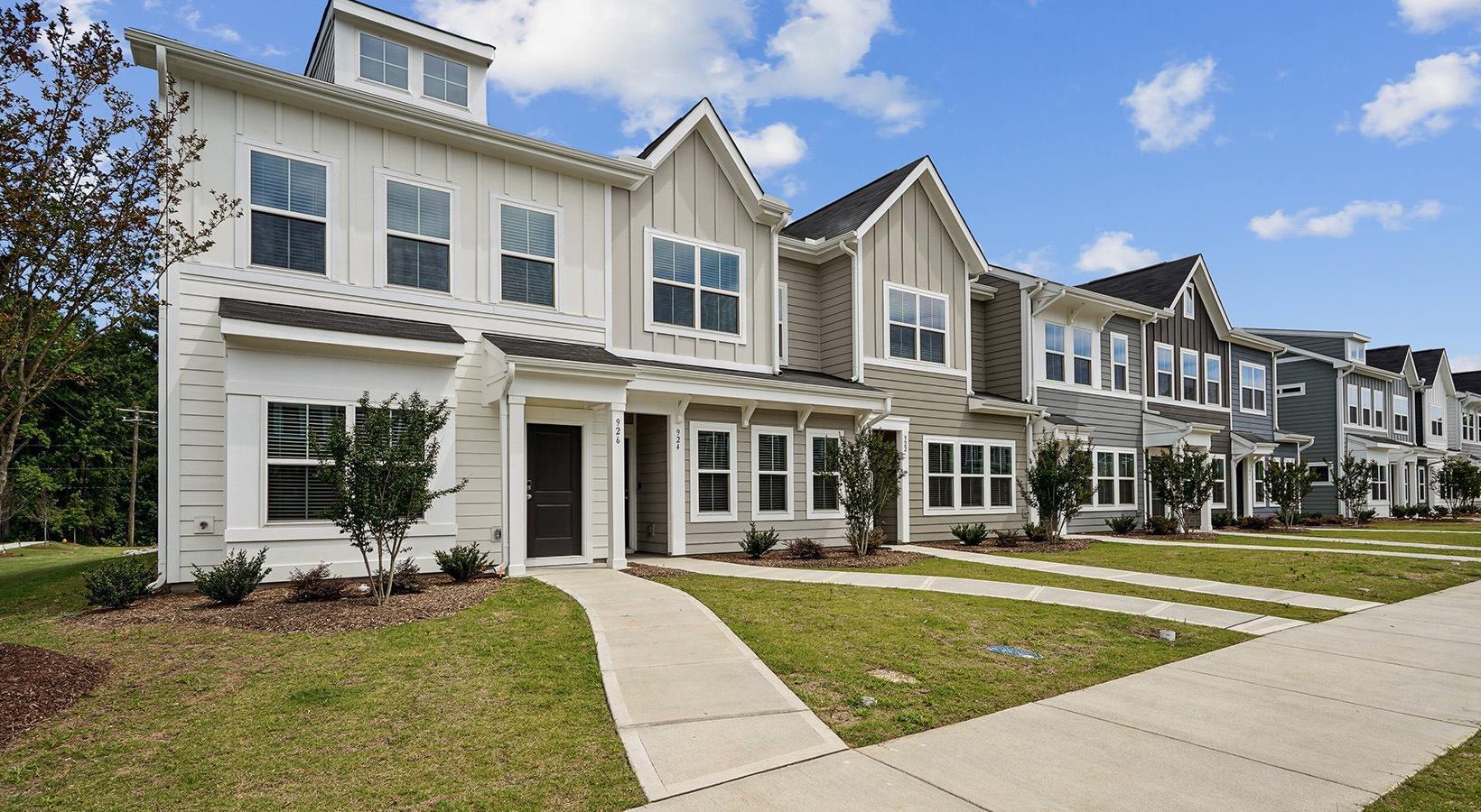 a view of a white building with a outdoor space