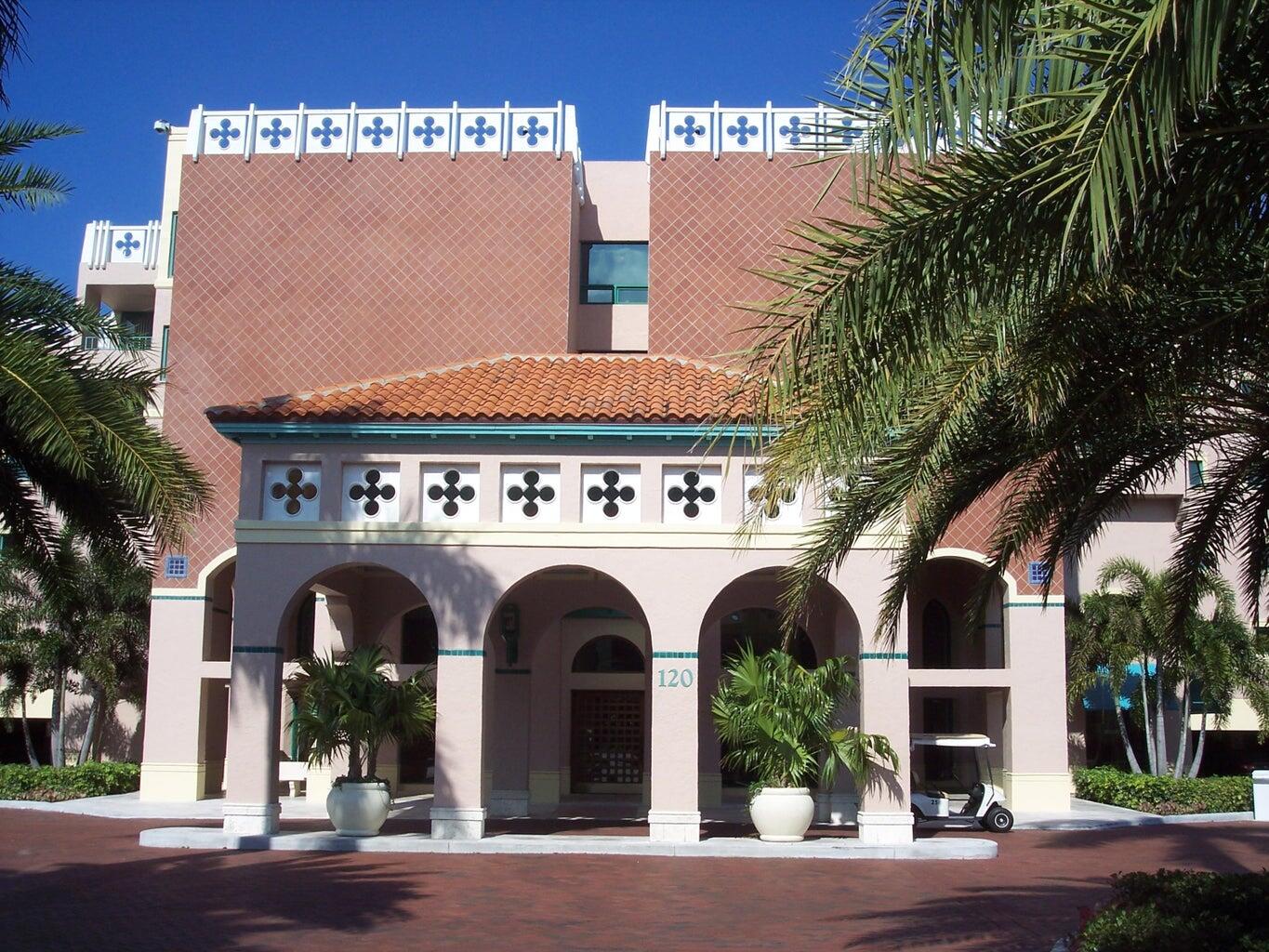 a view of building with potted plants