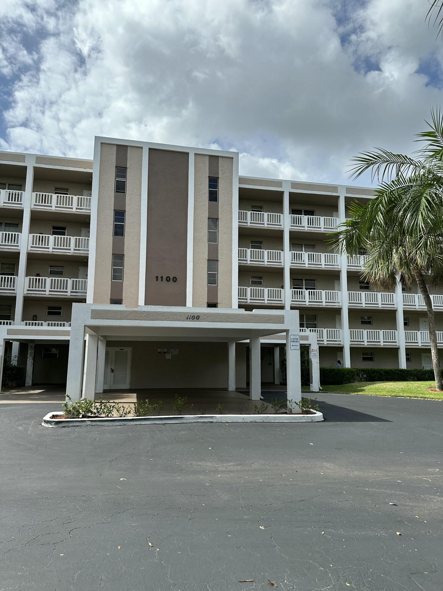 a front view of a building with a lot of windows