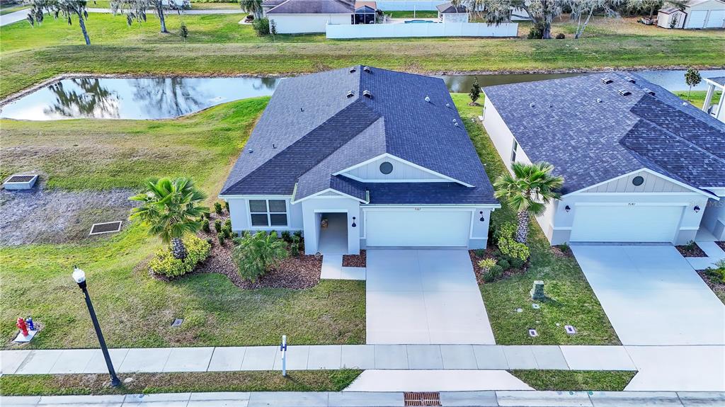 a aerial view of a house with a yard