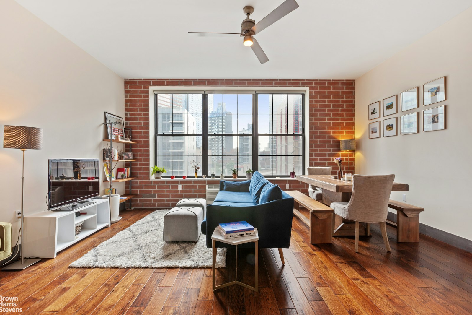 a living room with fireplace furniture and a flat screen tv