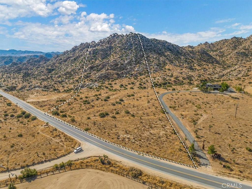 a view of a yard with a mountain