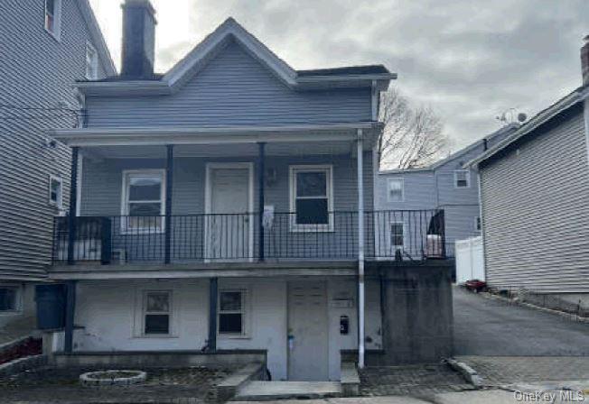 a front view of a house with a balcony