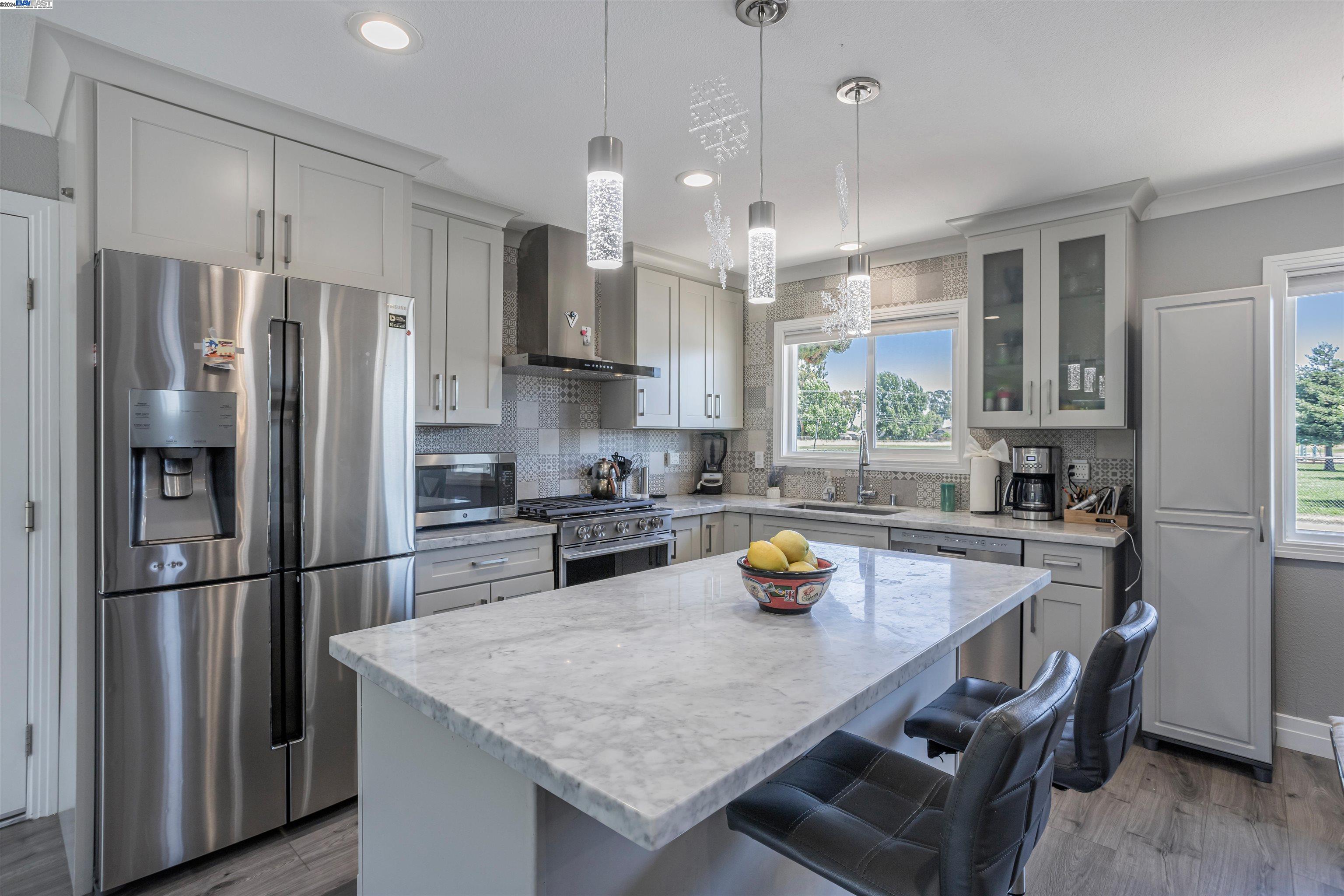 a kitchen with refrigerator a stove and wooden cabinets