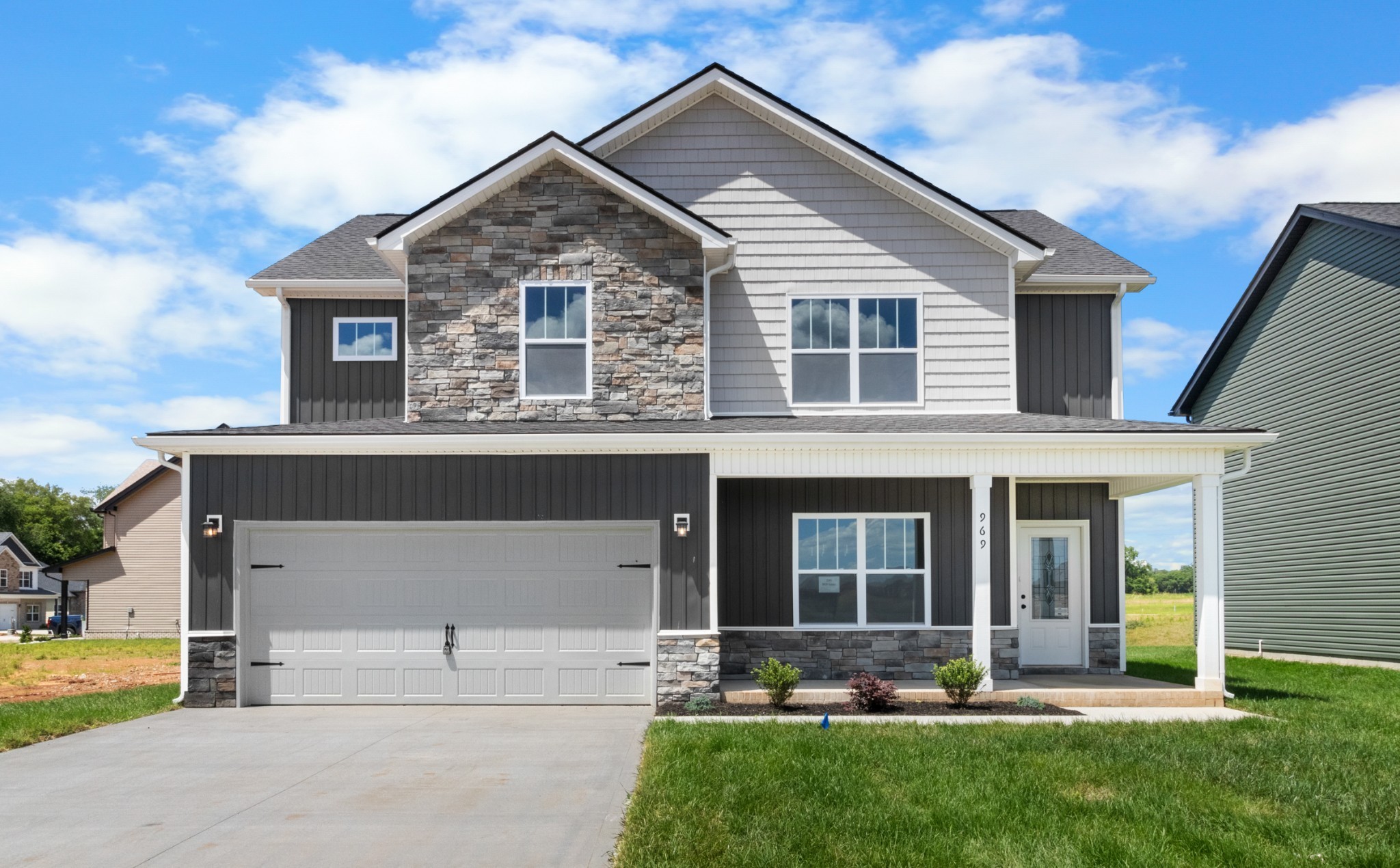 front view of a house with a yard