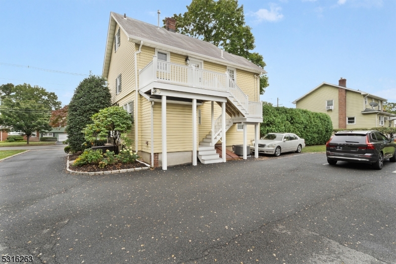 a view of a car park in front of house