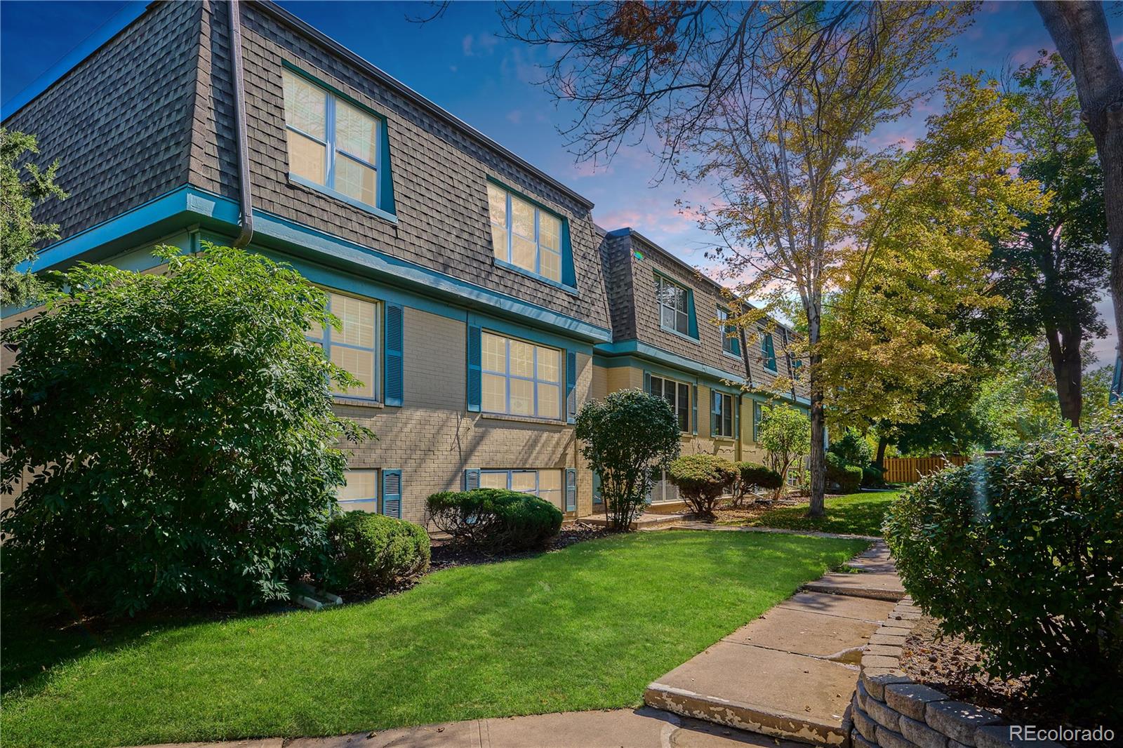 a view of a building with a yard