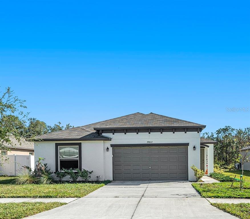 a front view of a house with a garage