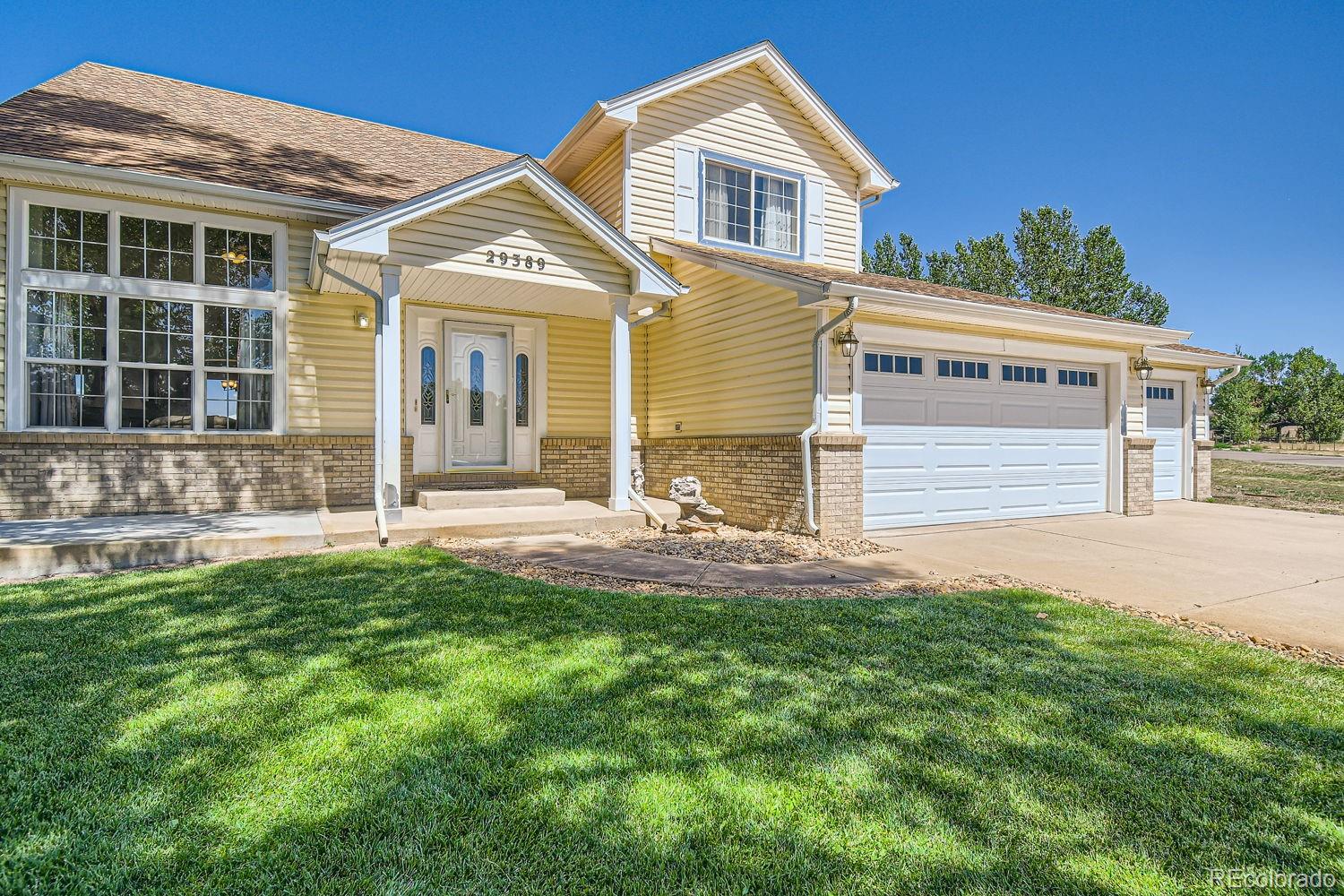 front view of a house with a yard