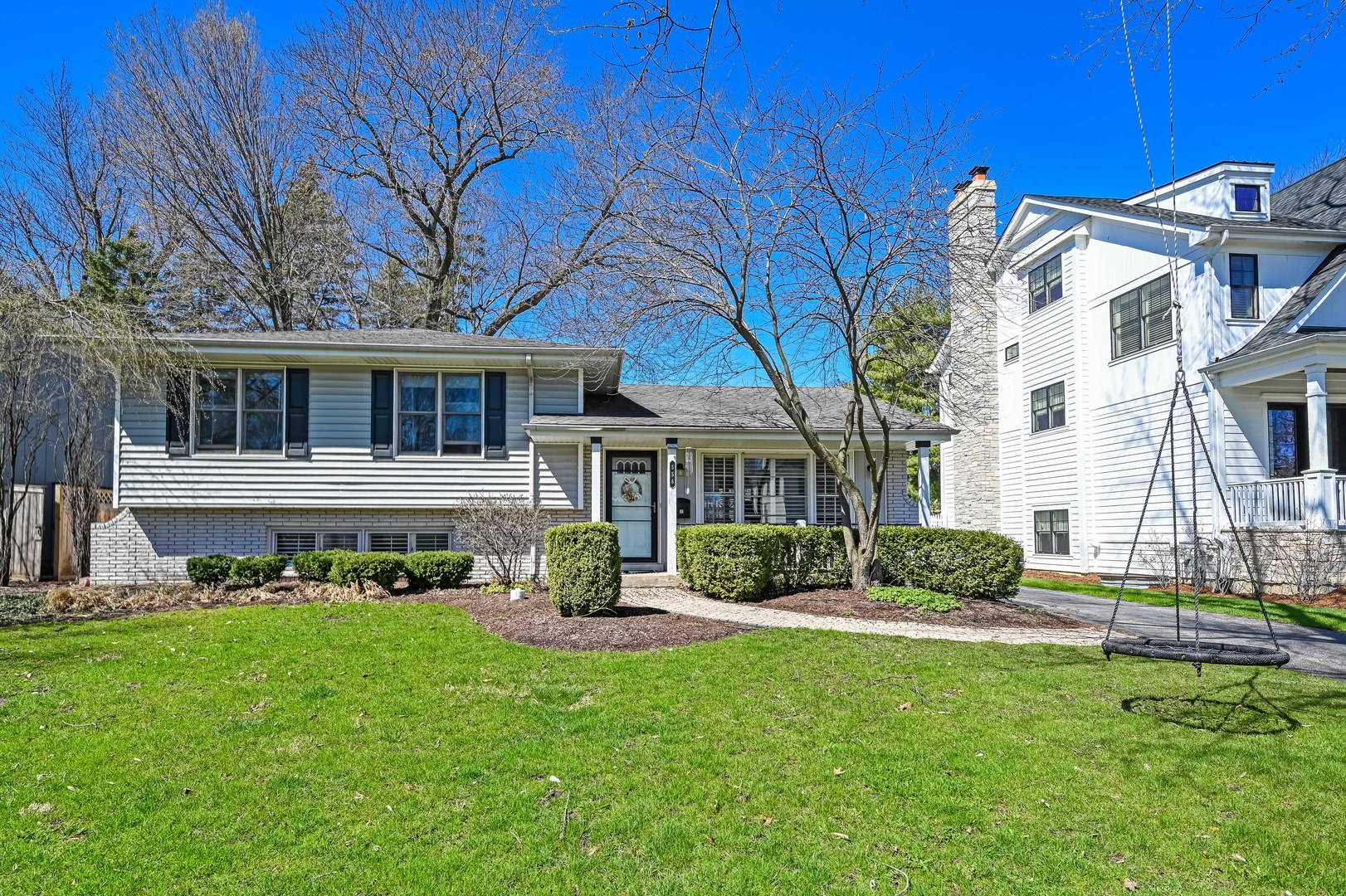 a front view of a house with a yard