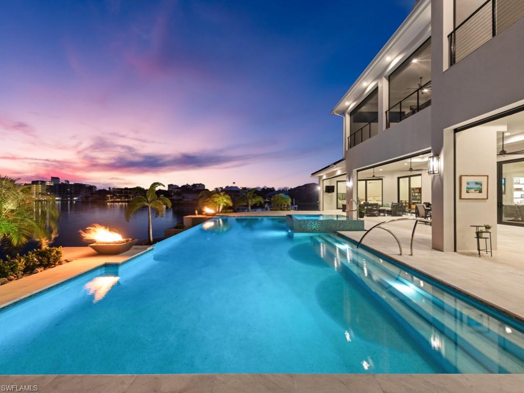 a view of a swimming pool with an outdoor seating