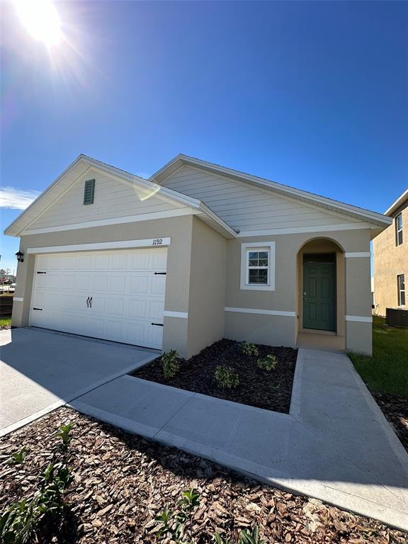 a front view of a house with a garage