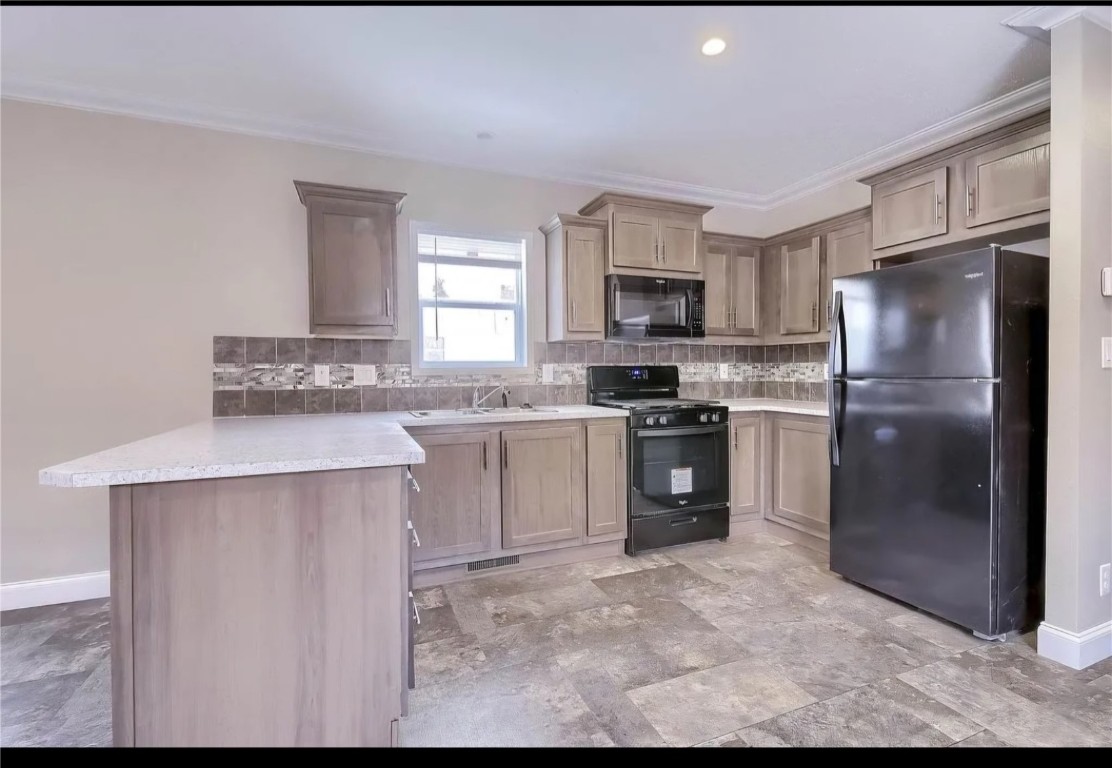 a kitchen with a refrigerator sink and microwave