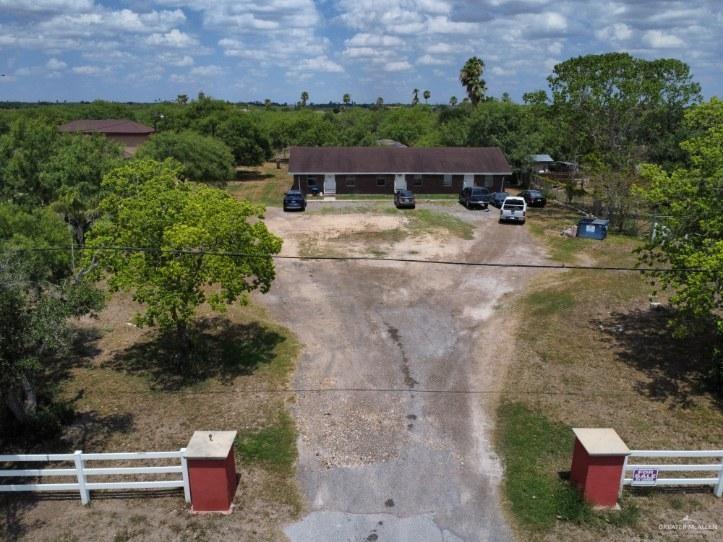 an aerial view of a house with outdoor space