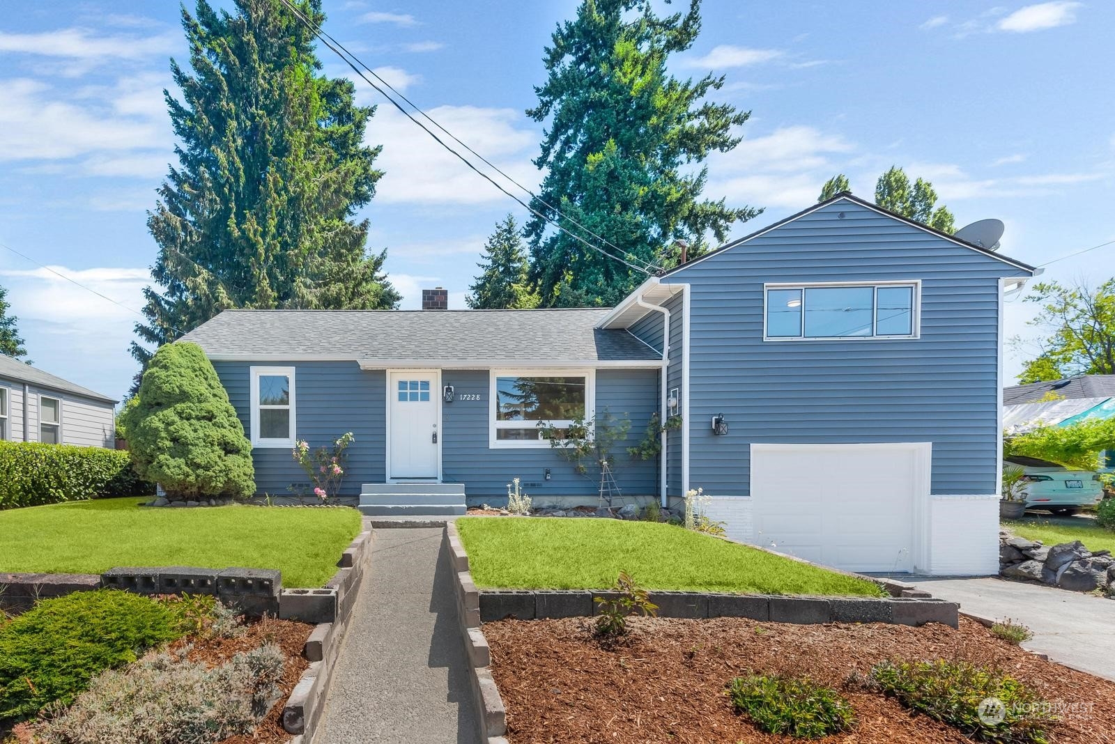 a view of front of house with a yard