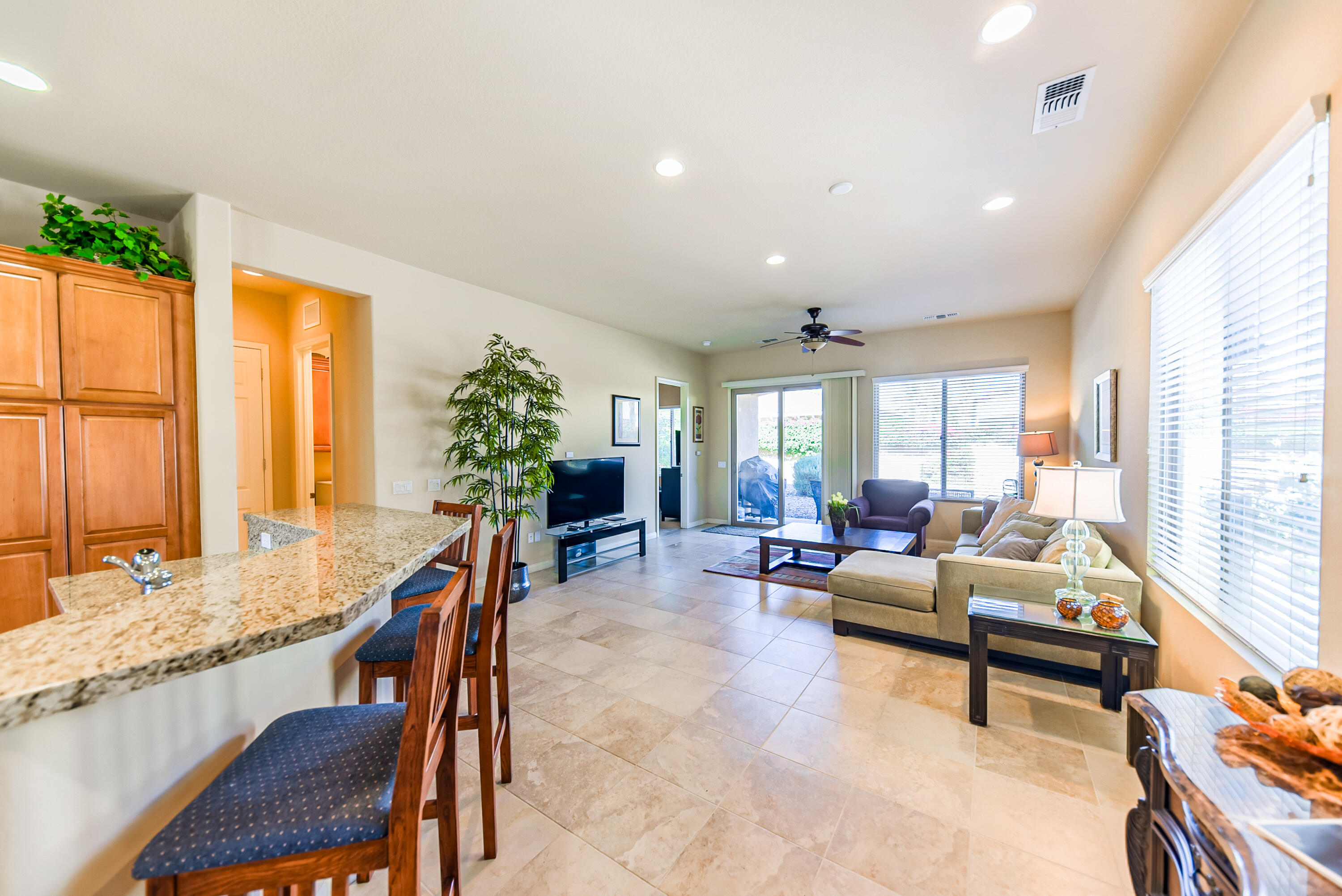 a living room with furniture and large windows