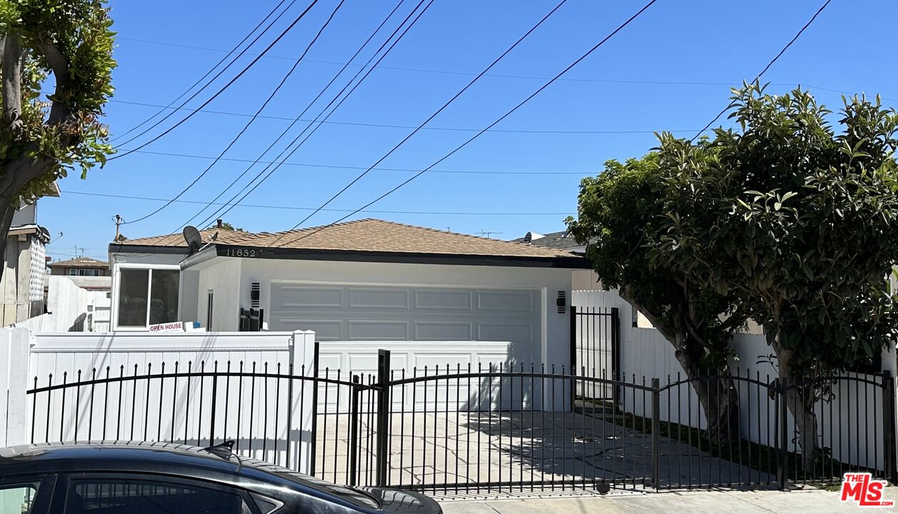 a view of a house with a small yard