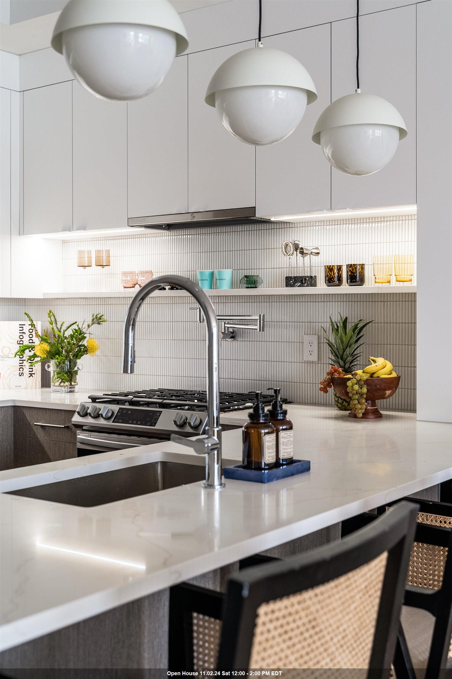 a kitchen with a table a stove and cabinets