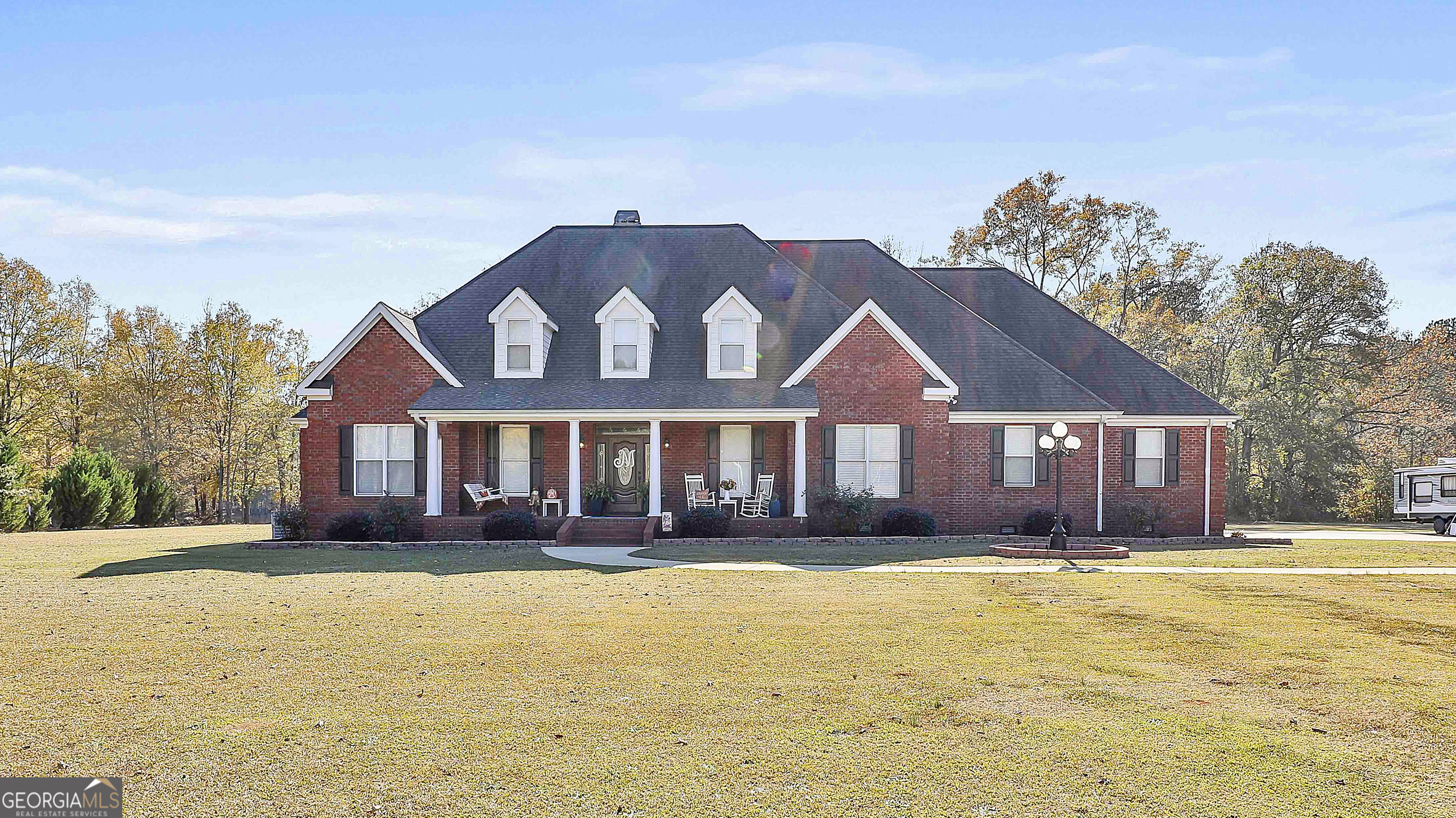 a front view of a house with a yard