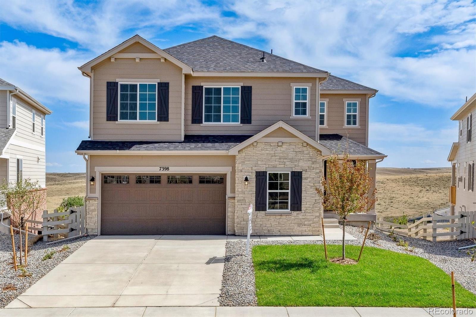 a front view of a house with a yard