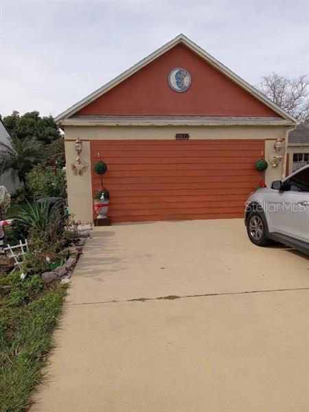 a front view of a house with garage