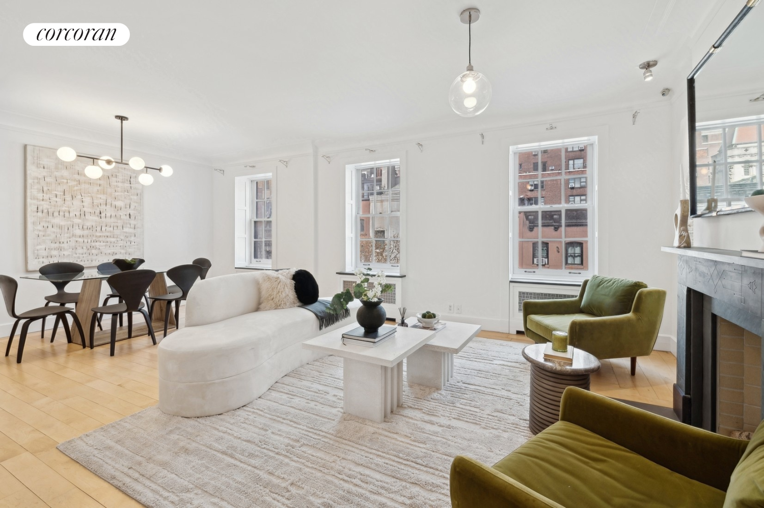 a living room with furniture and a chandelier