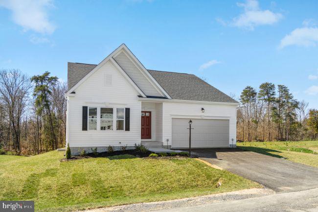 a view of house with yard