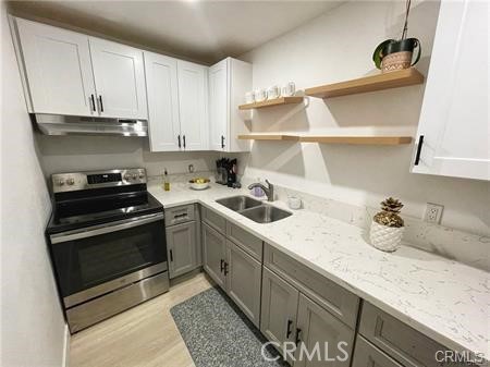 a kitchen with a sink and cabinets