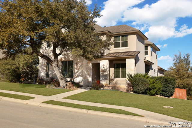 a front view of a house with a yard