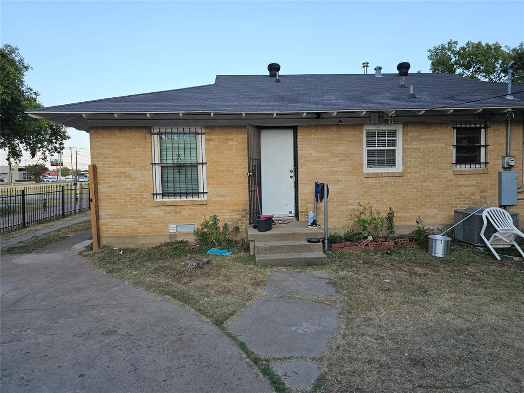 a view of a house with wooden deck and furniture