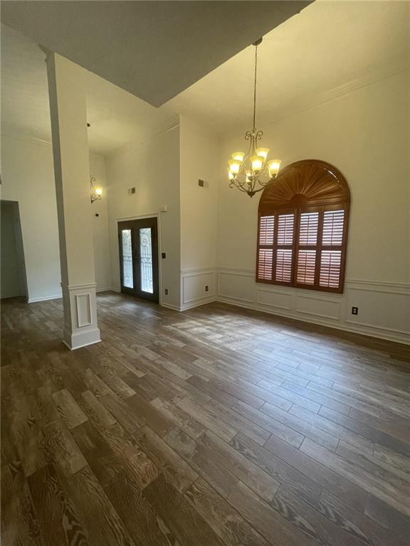 a view of a room with window and wooden floor