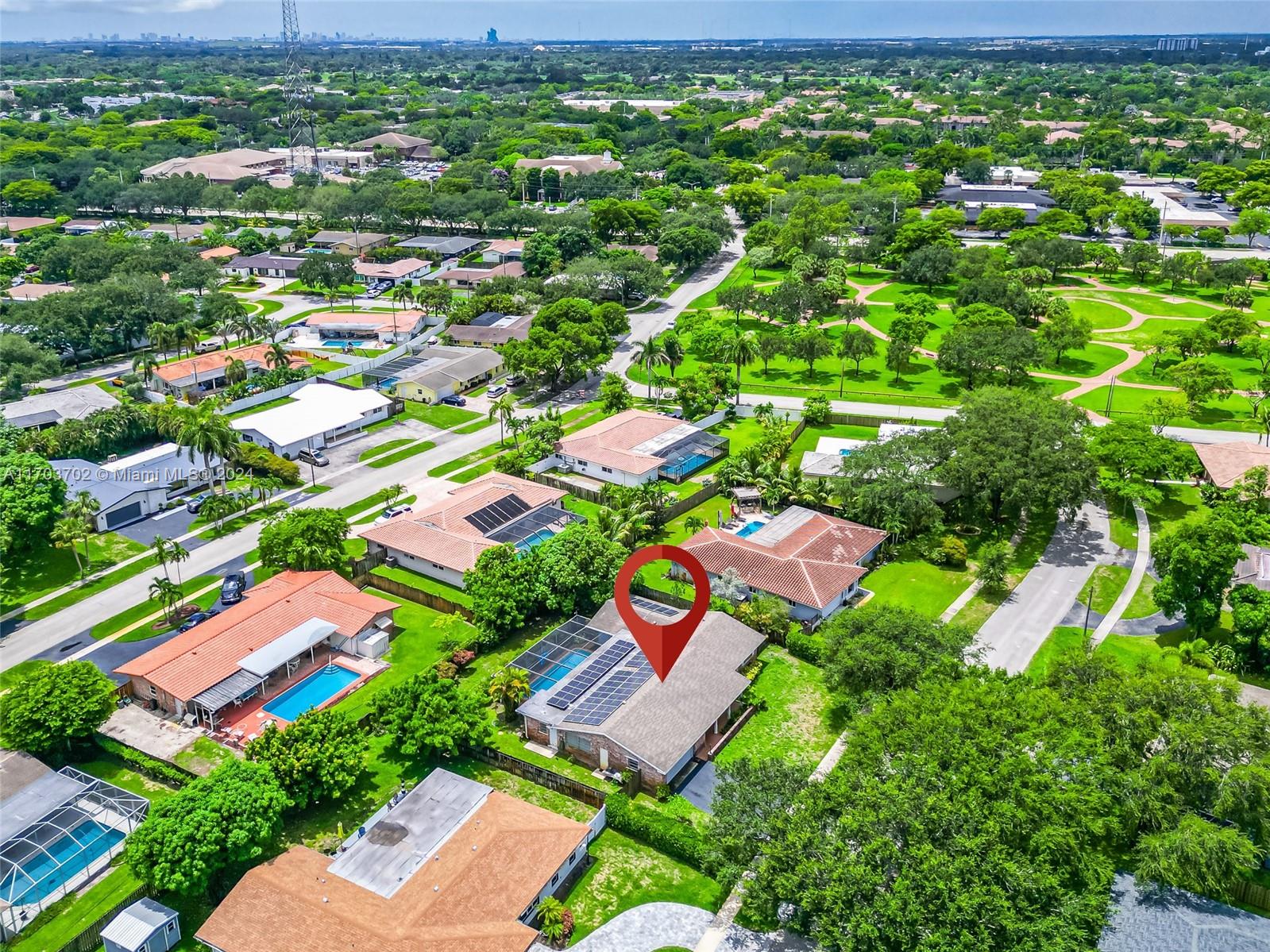 an aerial view of residential houses with outdoor space and street view